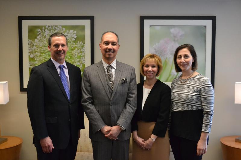 BayCoast Bank Executive Vice President and Chief Lending Officer Carl W. Taber (center, left) and Vice President and Regional Branch Manager Paula Freitas, (center, right) pause for a photo with Southcoast President & CEO Keith Hovan (left) and ob/gyn physician Veronica DelRiccio (right) during a recent tour of the newly renovated Stoico / FIRSTFED Maternity Center at St. Luke’s Hospital in New Bedford. BY SOUTHCOAST HEALTH